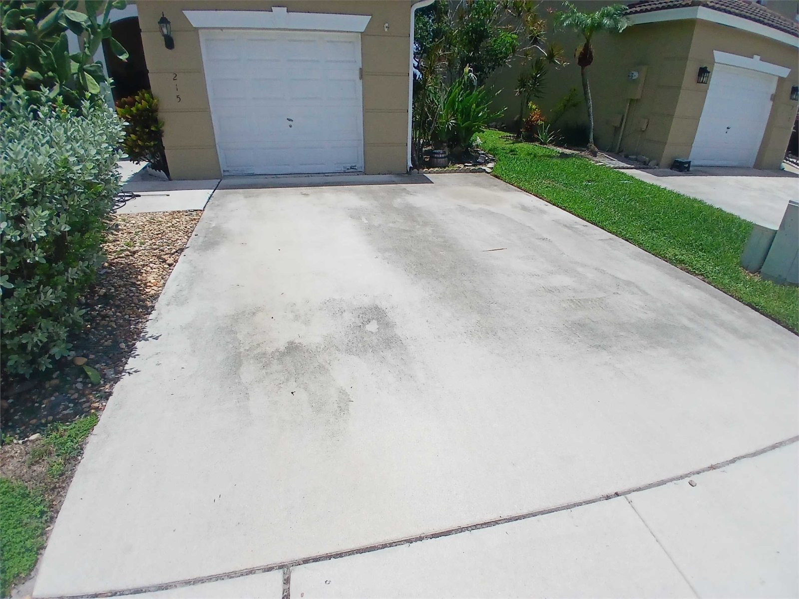 Concrete driveway before pressure washing